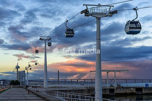Lisbon, Portugal - 15 December 2020: view of the Telecabine Lisboa cable car gondolas at the World Expo grounds in Lisbon at sunset