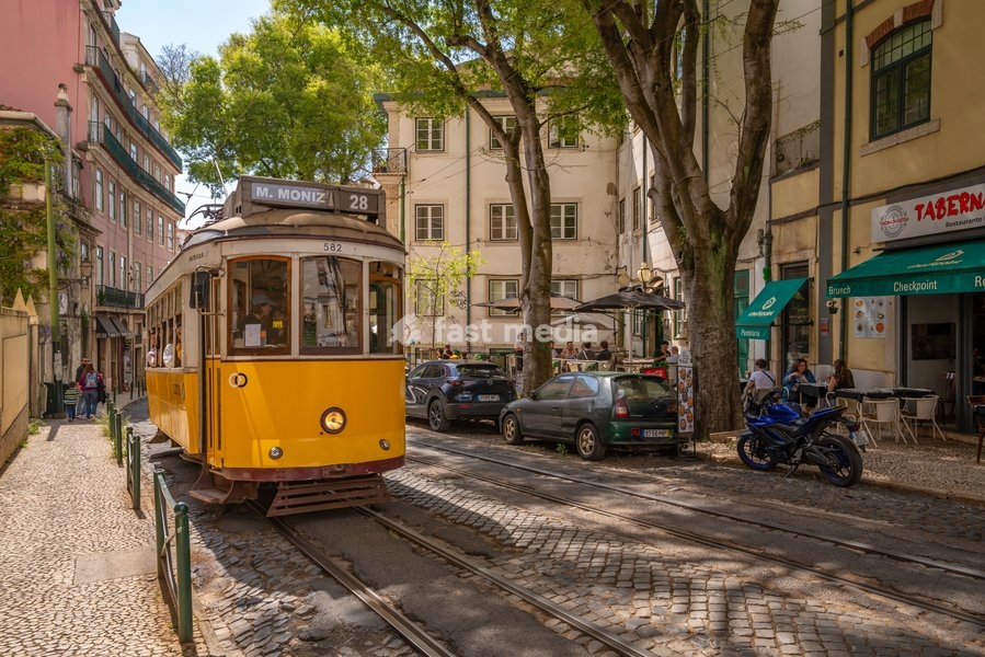 View of colourful architectecture and vintage tram in Alfama, Alfama District, Lisbon, Portugal, Europe