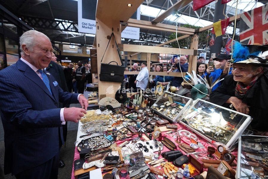 Britain's King Charles talks to stall holders as he attends the South by SouthWest London (SXSW London), a culture, technology and creativity festival in Shoreditch, London, Thursday, June 5, 2025