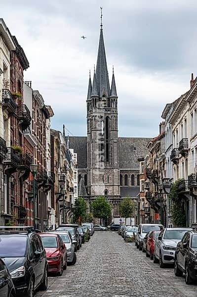 Rue Ourthe and the Saint Remigius church during car free sunday, Molenbeek, Brussels, Belgium, SEP 22, 2024, Europe