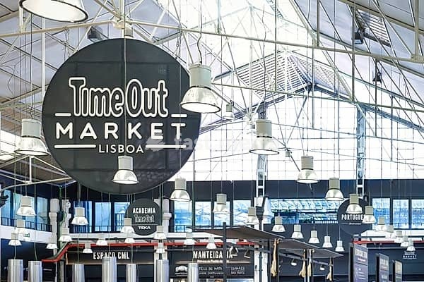 Lisbon, Portugal May 29 2024: view of the roof construction with advertising signs and lamps of the Time Out Market in the Mercado da Ribeira halls in lisbon