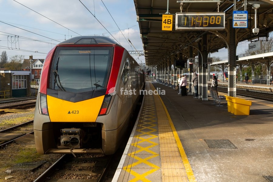 Greater Anglia, British Rail Class Stadler 755 bi-modal multiple unit passenger train arriving at Ipswich railway station, Suffolk, England, UK