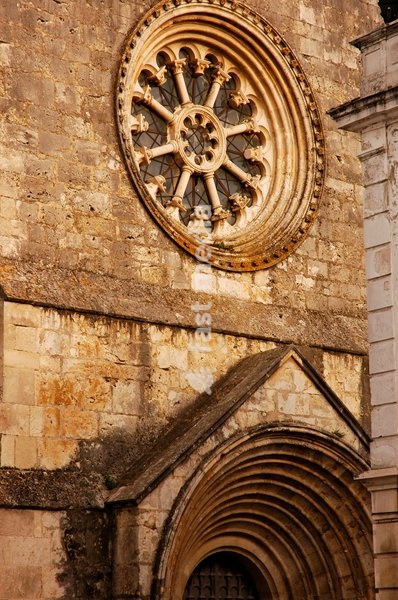 Sao Joao de Alporao Church, Santarém, Portugal, 12th-13th centuries (2008). Romanesque and Gothic styles. Architectural detail of the facade, with the rose window which lights up the single interior nave, the location of the Archaeological Museum. District of Setúbal
