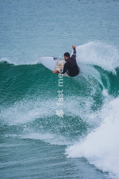 Surfers in popular beach of Supertubos, Peniche, Portugal