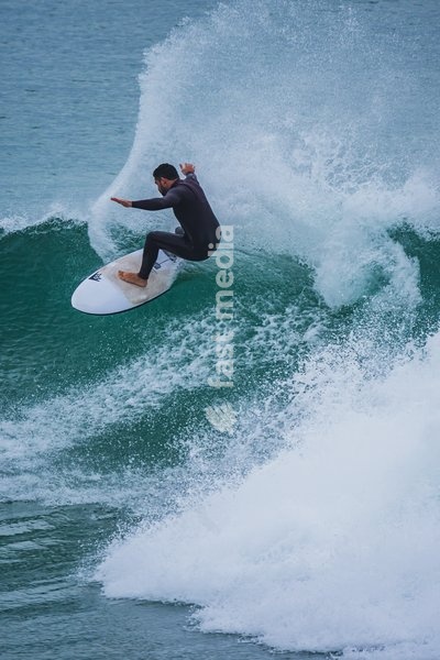 Surfers in popular beach of Supertubos, Peniche, Portugal