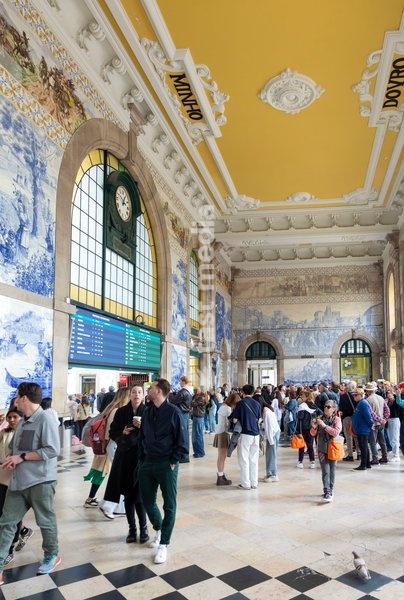 Tour groups viewing historic azulejos tiles, Sao Bento railway station building, city of Porto, Portugal, Europe