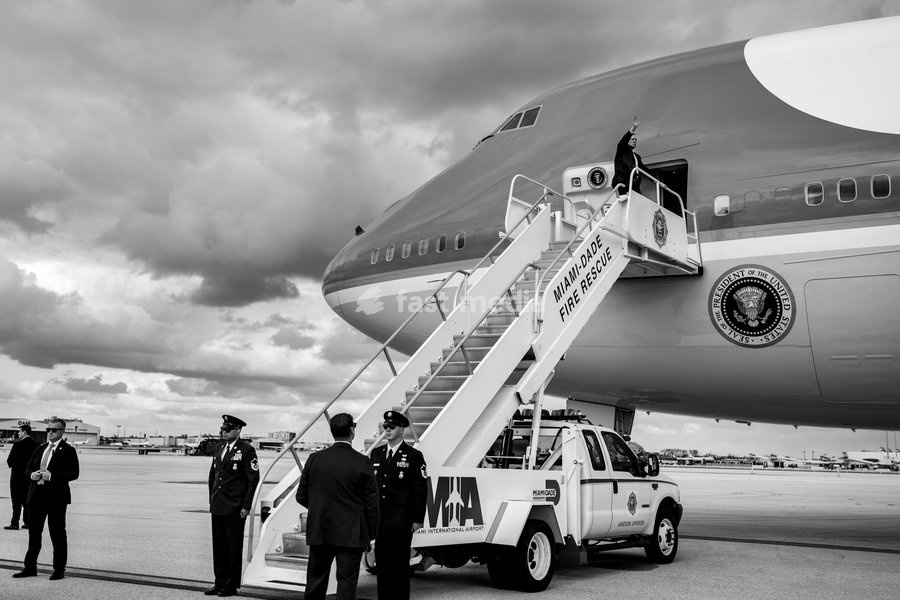 President Donald Trump waves to members of the media as he boards Air Force One at Miami International Airport, Wednesday, November 5, 2025