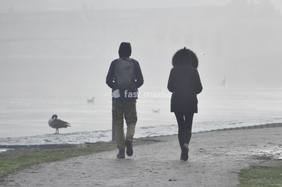 Walkers along The thames Path in the mist