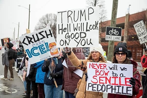 Detroit, Michigan USA - 13 January 2026 - Hundreds of protesters rallied in the rain outside the Motor City Casino as President Donald Trump spoke to the Detroit Economic Club inside