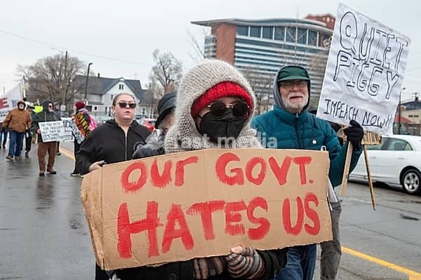 Detroit, Michigan USA - 13 January 2026 - Hundreds of protesters rallied in the rain outside the Motor City Casino as President Donald Trump spoke to the Detroit Economic Club inside