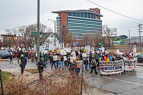 Detroit, Michigan USA - 13 January 2026 - Hundreds of protesters rallied in the rain outside the Motor City Casino as President Donald Trump spoke to the Detroit Economic Club inside