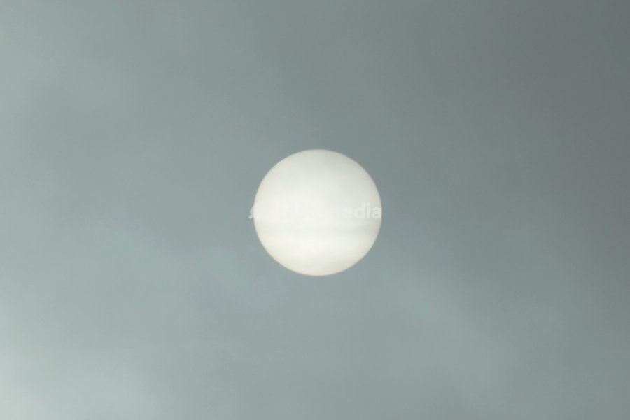 The sun burns through the mornings light mist over the countryside