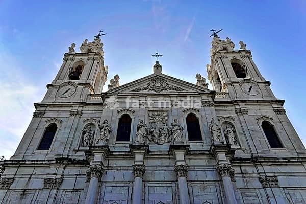 Basilica da Estrela consecrated in 1790, burial place of Queen Maria I, Lisbon, Lisbon, Portugal, impressive façade of a historic church with detailed sculptures and two towers, Lisbon, Portugal