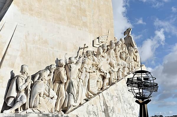 Monument of Discoveries, Padrao dos Descobrimentos, monument with important figures of Portuguese seafaring on the banks of the Tagus River, Belem, Lisbon, Portugal, monument with rising figures and a metal globe decorated with artistic stone reliefs, Lisbon, Portugal