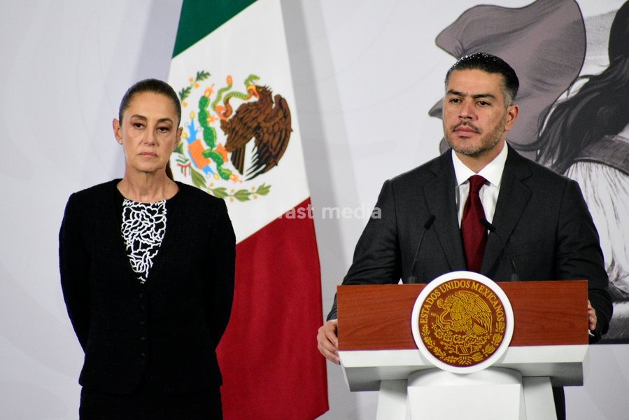 Mexico’s President Claudia Sheinbaum Pardo is seen behind while the Secretary of Security and Citizen Protection, Omar Garcia Harfuch, speaking during a briefing conference on the monthly security report at National Palace. on February 10, 2026 in Mexico City, Mexico