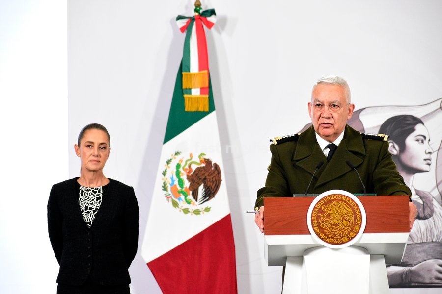 Mexico’s President Claudia Sheinbaum Pardo is seen behind while the Minister of Mexican National Defense, Ricardo Trevilla Trejo, speaking during a briefing conference on the monthly security report at National Palace. on February 10, 2026 in Mexico City, Mexico
