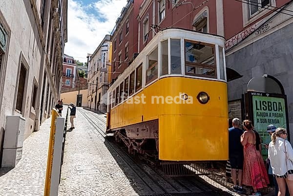 Lisboa, Portugal - June 04, 2024 - Iconic Elevador da Gloria in old town Lisbon winds its way up the alleyway, Portugal
