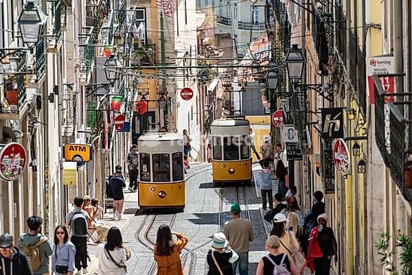 Lisboa, Portugal - June 04, 2024 - Iconic historic Ascensor da Bica in old town Lisboa, Portugal, Tajo river in the background