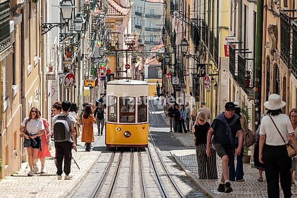 Lisboa, Portugal - June 04, 2024 - Iconic historic Ascensor da Bica in old town Lisboa, Portugal, Tajo river in the background