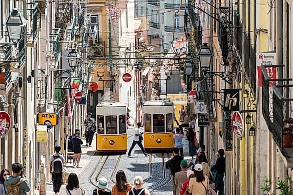 Lisboa, Portugal - June 04, 2024 - Iconic historic Ascensor da Bica in old town Lisboa, Portugal, Tajo river in the background
