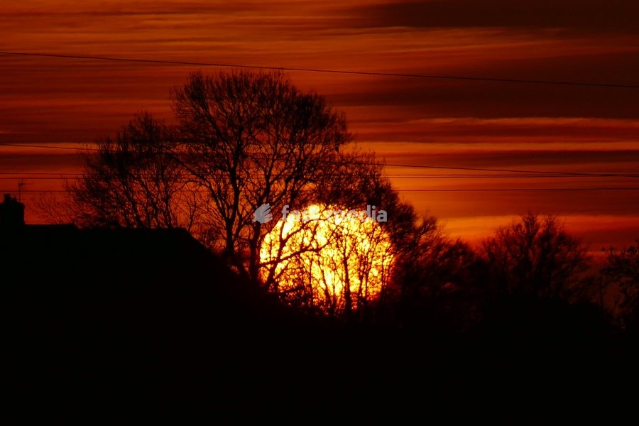 The days sun rises over the countryside