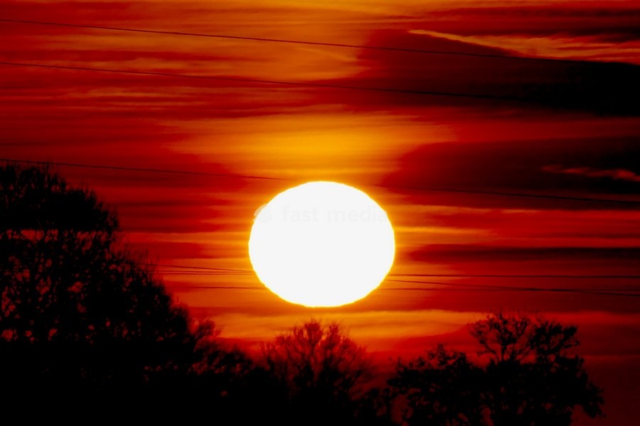 The days sun rises over the countryside