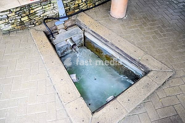A small swimming pool with holy water from the spring. A niche in the floor for recruiting water from a source
