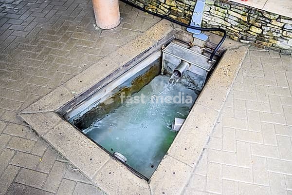 A small swimming pool with holy water from the spring. A niche in the floor for recruiting water from a source