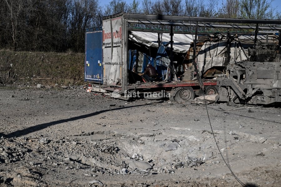 A place of impact is pictured at a parking lot after a Russian drone strike in Zaporizhzhia, Ukraine, April 15, 2026. The attack killed a 74-year-old woman and damaged the stop, a parking lot, and nearby residential buildings