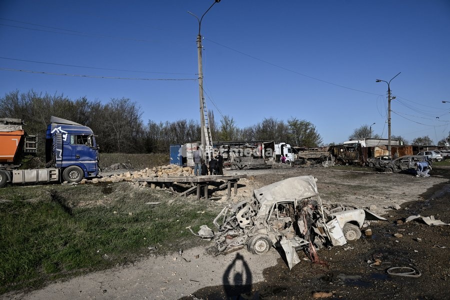 Cars at a parking lot are destroyed by a Russian drone strike in Zaporizhzhia, Ukraine, April 15, 2026. The attack killed a 74-year-old woman and damaged the stop, a parking lot, and nearby residential buildings