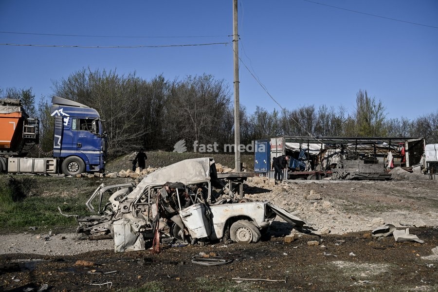 A car destroyed by a Russian drone strike is at a parking lot in Zaporizhzhia, Ukraine, April 15, 2026. The attack killed a 74-year-old woman and damaged the stop, a parking lot, and nearby residential buildings
