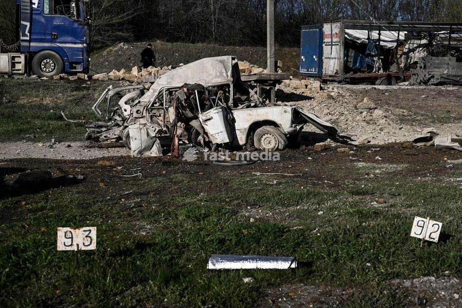 A car destroyed by a Russian drone strike is at a parking lot in Zaporizhzhia, Ukraine, April 15, 2026. The attack killed a 74-year-old woman and damaged the stop, a parking lot, and nearby residential buildings