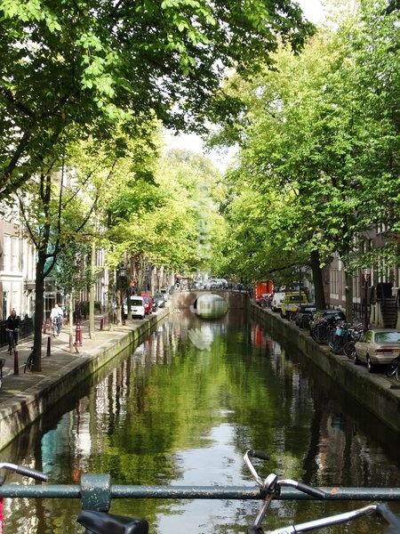 The Amsterdam canal system is the result of conscious city planning. In the early 17th century, when immigration was at a peak, a comprehensive plan was developed that was based on four concentric half-circles of canals with their ends emerging at the IJ bay