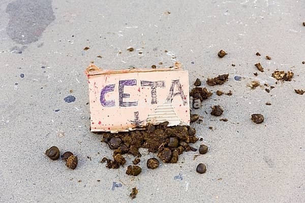 Belgium, Brussels on 2016/10/30: demonstration near the Institutional seat of the European Union against the Comprehensive Economic and Trade Agreement (CETA) and the transatlantic trade deals between the EU and the US and Canada. CETA sign and horse droppings, Europe, Western Europe, Belgium