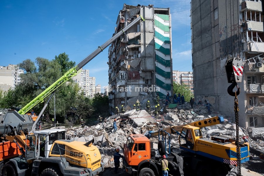 Rescuers from the State Emergency Service remove the rubble at a nine-storey apartment block damaged by a Russian missile and drone strike in Kyiv, Ukraine, on May 14, 2026. Russia launched a massive attack on the Ukrainian capital, deploying more than 670 strike drones and 56 missiles of various…