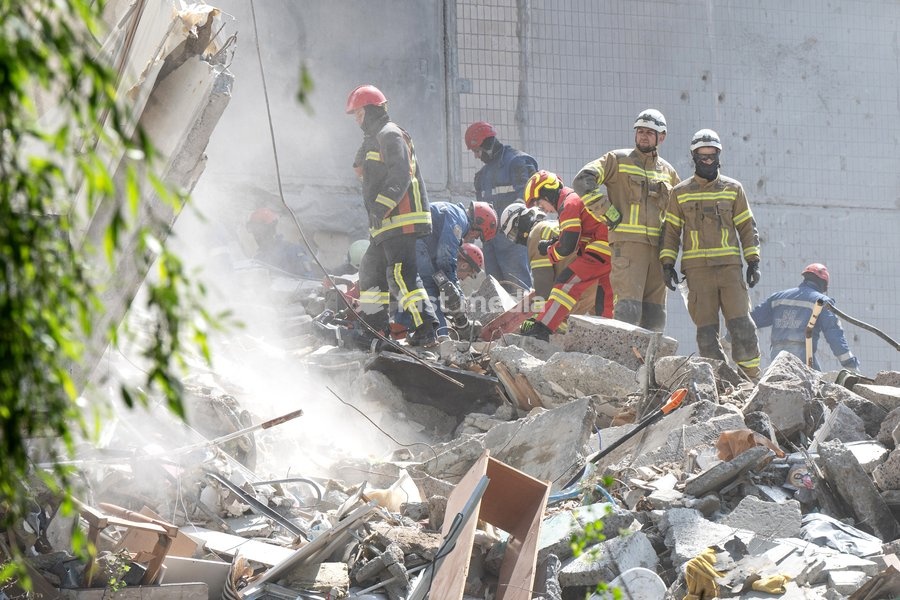 Rescuers from the State Emergency Service remove the rubble at a nine-storey apartment block damaged by a Russian missile and drone strike in Kyiv, Ukraine, on May 14, 2026. Russia launched a massive attack on the Ukrainian capital, deploying more than 670 strike drones and 56 missiles of various…