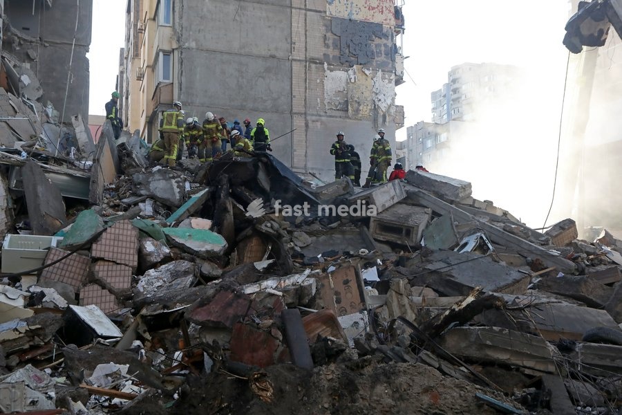 Rescuers from the State Emergency Service remove the rubble at a nine-storey apartment block damaged by a Russian missile and drone strike in Kyiv, Ukraine, on May 14, 2026. Russia launched a massive attack on the Ukrainian capital, deploying more than 670 strike drones and 56 missiles of various…