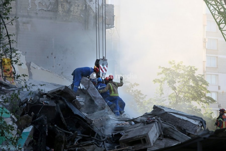 Rescuers from the State Emergency Service use a crane as they remove the rubble at a nine-storey apartment block damaged by a Russian missile and drone strike in Kyiv, Ukraine, on May 14, 2026. Russia launched a massive attack on the Ukrainian capital, deploying more than 670 strike drones and 56…