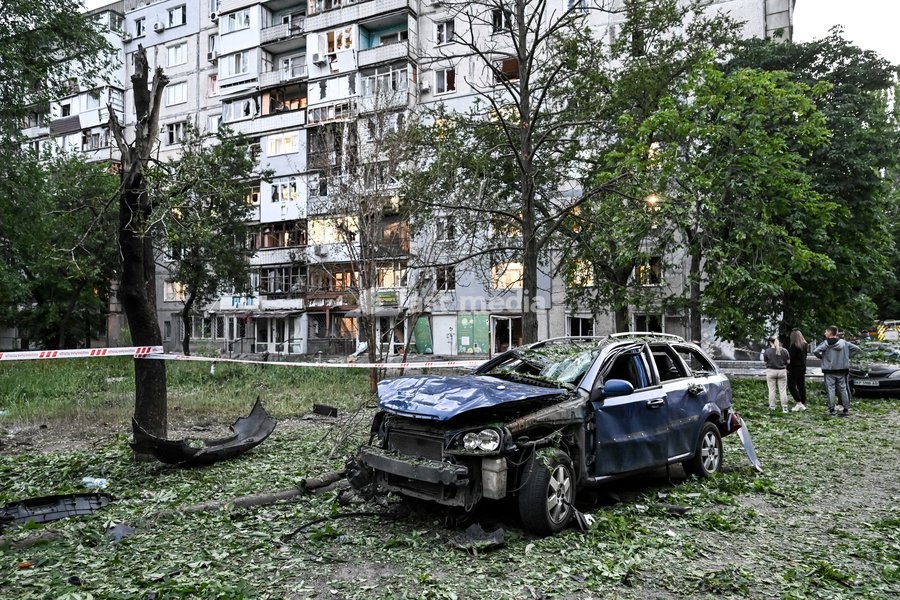 Cars, parked outside a residential building, are damaged by a Russian drone strike on the Shevchenkivskyi district of Zaporizhzhia, Ukraine, June 4, 2026. Russian forces launched a drone strike on one of the city’s residential areas, killing one person and injuring 16 others. The blast wave and…