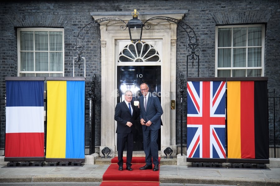 British Prime Minister Sir Keir Starmer poses for a photo with German Chancellor Frederich Merz as he arrives for a quadliateral meeting in Downing Street, London, England, UK on Sunday 7 June, 2026