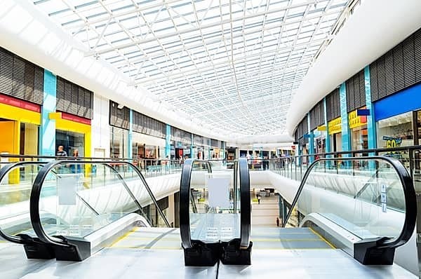 Panoramic view of a modern mall and escalator