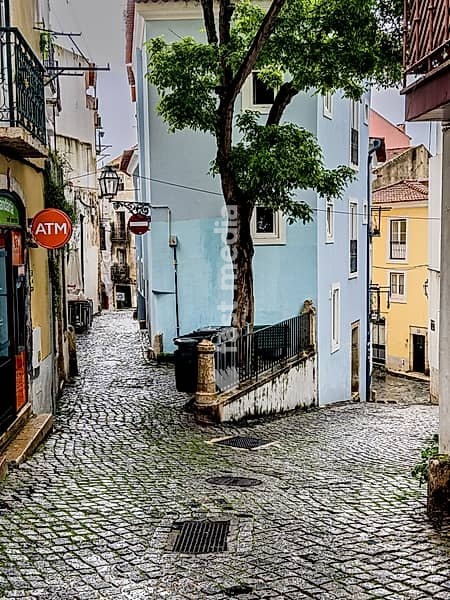 Colourful facades on a narrow alley in the old town of Lisbon, Portugal. Colourful facades in a narrow alley in the old town of Lisbon, Portugal