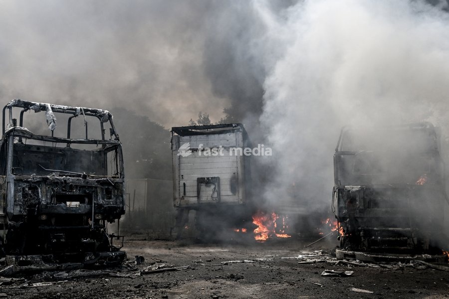 Trucks are engulfed by smoke from a fire at a parking lot, caused by Russian drone strikes, Zaporizhzhia, Ukraine, June 25, 2026. The Russian army attacked the city with strike drones, targeting a petrol station, Ukrzaliznytsia (Ukrainian Railways) locomotives and a parking lot. Fires broke out,…