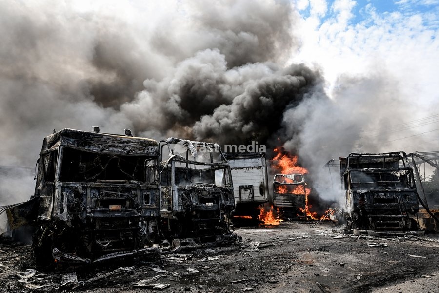 Trucks are engulfed by smoke from a fire at a parking lot, caused by Russian drone strikes, Zaporizhzhia, Ukraine, June 25, 2026. The Russian army attacked the city with strike drones, targeting a petrol station, Ukrzaliznytsia (Ukrainian Railways) locomotives and a parking lot. Fires broke out,…