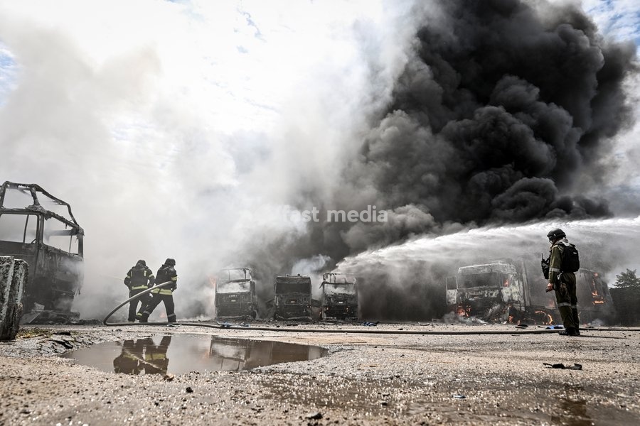 Rescuers work to extinguish a fire caused by Russian drone strikes at a parking lot, Zaporizhzhia, Ukraine, June 25, 2026. The Russian army attacked the city with strike drones, targeting a petrol station, Ukrzaliznytsia (Ukrainian Railways) locomotives and a parking lot. Fires broke out, and one…