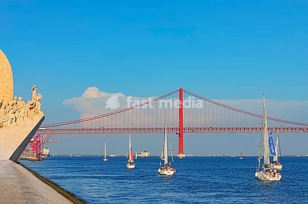 View of Ribeira das Naus esplanade and Monument to the Discoveries in the distance, Belem, Lisbon, Portugal