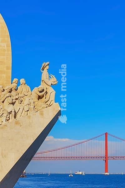 View of Monument to the Discoveries (Padrao dos Descobrimentos) and 25th April bridge in the distance, Belem, Lisbon, Portugal