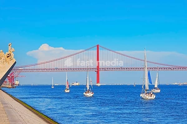 View of Ribeira das Naus esplanade and Monument to the Discoveries in the distance, Belem, Lisbon, Portugal