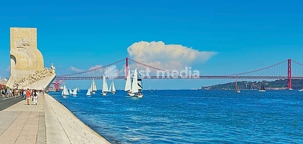 View of Ribeira das Naus esplanade and Monument to the Discoveries in the distance, Belem, Lisbon, Portugal