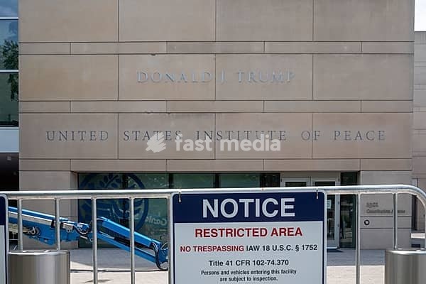 Washington, DC - President Donald Trump's name, added to the United States Institute of Peace building months after Trump tried to dismantle the independent agency